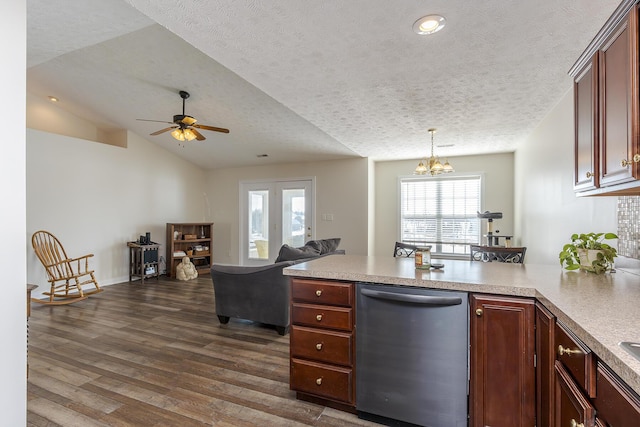 kitchen with pendant lighting, a textured ceiling, lofted ceiling, dark hardwood / wood-style floors, and stainless steel dishwasher