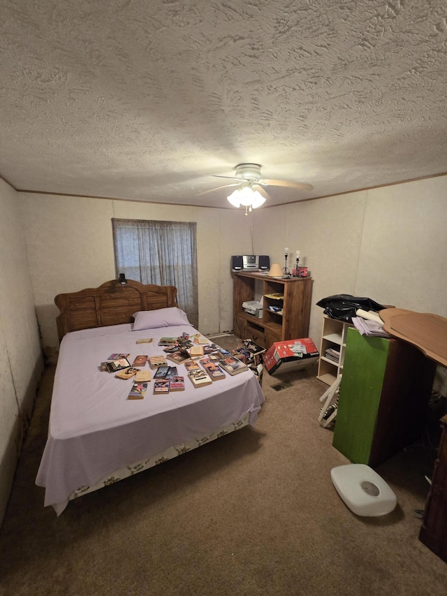 carpeted bedroom with ceiling fan and a textured ceiling