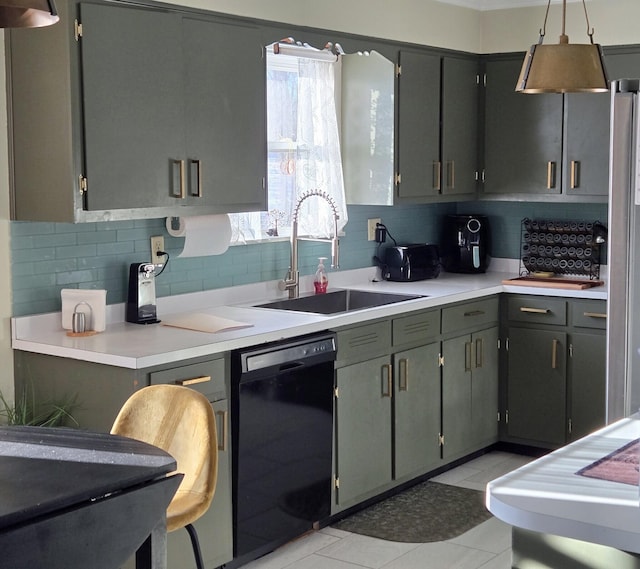 kitchen with sink, hanging light fixtures, light tile patterned floors, black dishwasher, and decorative backsplash