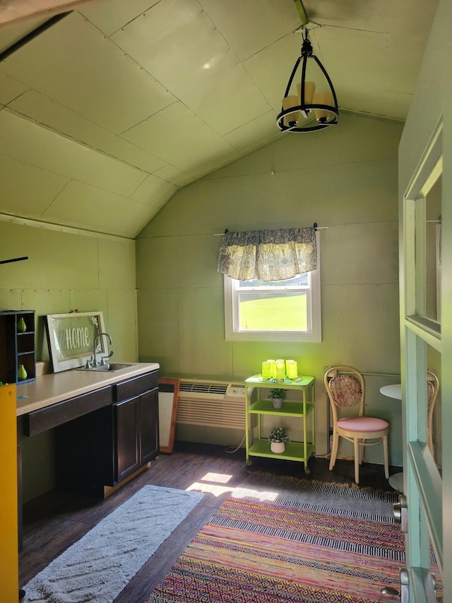 bonus room featuring vaulted ceiling and sink