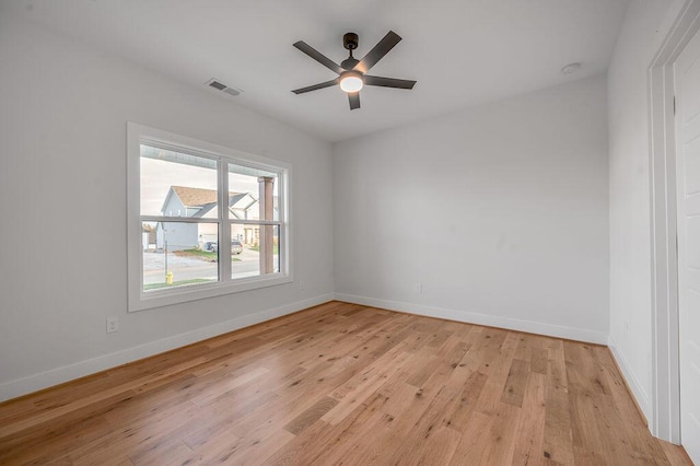 empty room featuring ceiling fan and light hardwood / wood-style flooring