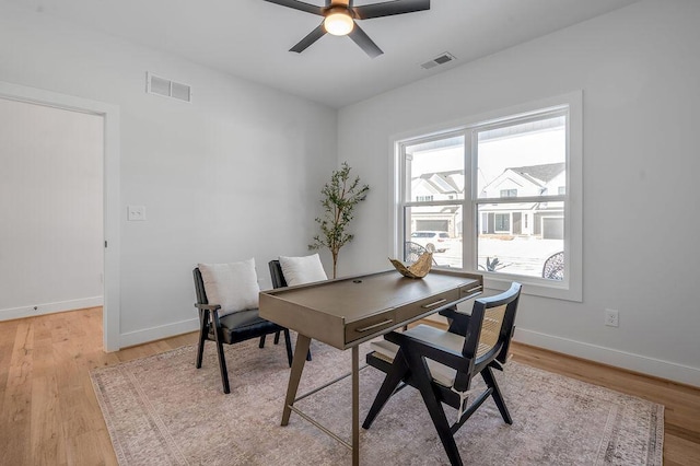 dining space with ceiling fan, light hardwood / wood-style floors, and plenty of natural light