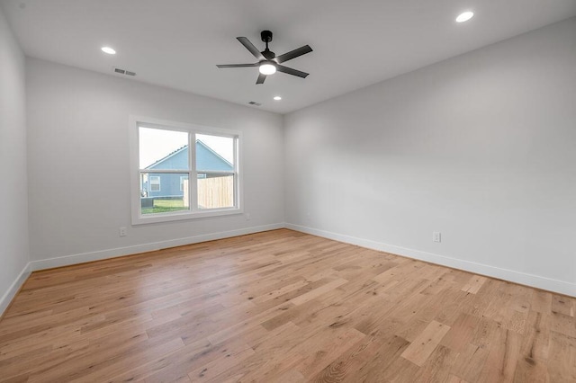 unfurnished room with ceiling fan and light wood-type flooring