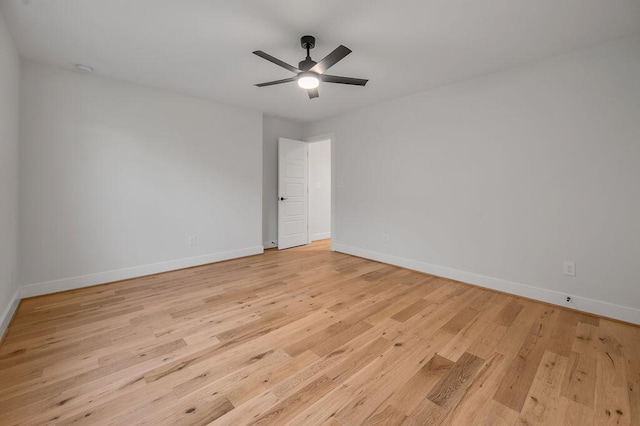 unfurnished room with ceiling fan and light wood-type flooring