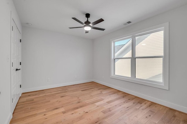 spare room featuring light hardwood / wood-style floors and ceiling fan