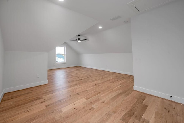 additional living space featuring ceiling fan, vaulted ceiling, and light hardwood / wood-style floors