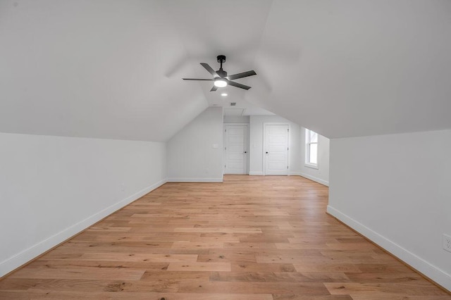 bonus room featuring ceiling fan, vaulted ceiling, and light hardwood / wood-style flooring