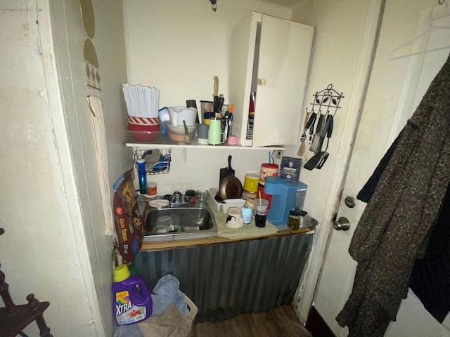 interior space featuring hardwood / wood-style flooring and sink