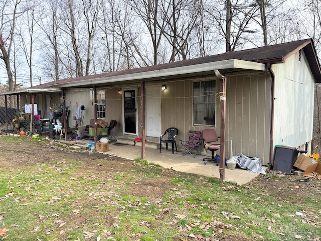 rear view of property featuring a patio