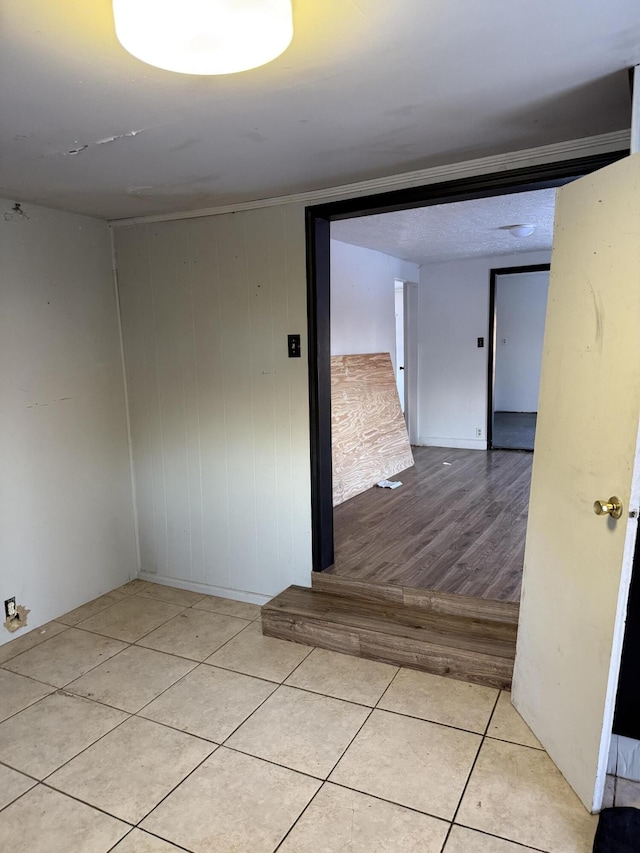 tiled empty room with wooden walls