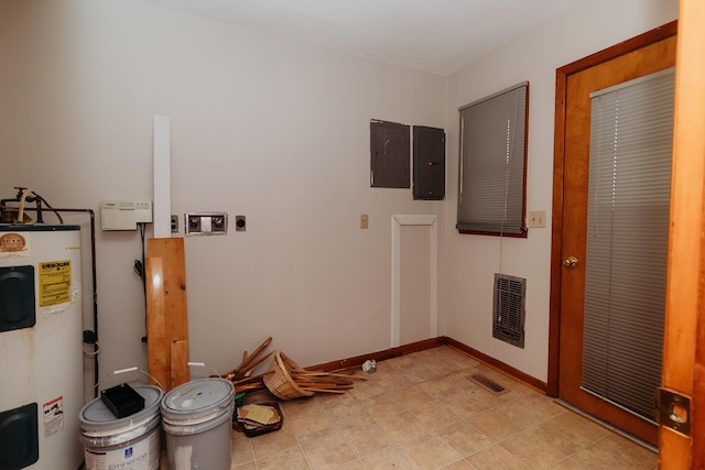 washroom with electric dryer hookup, electric panel, and electric water heater