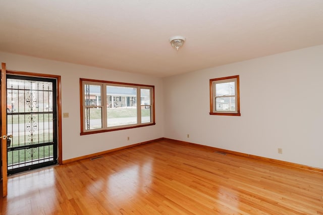 unfurnished room featuring light hardwood / wood-style flooring