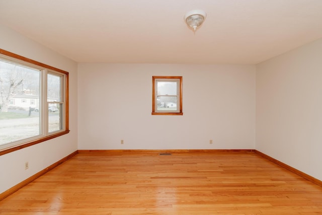 spare room with light wood-type flooring