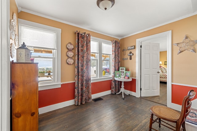 sitting room with dark hardwood / wood-style flooring and ornamental molding