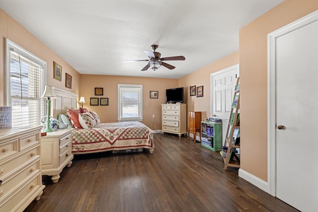 bedroom with ceiling fan and dark hardwood / wood-style flooring