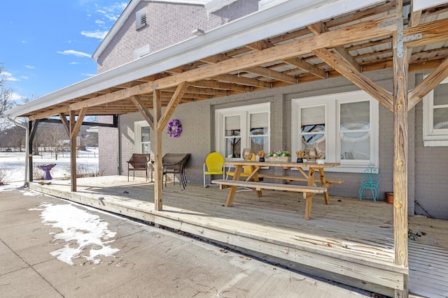 view of snow covered deck