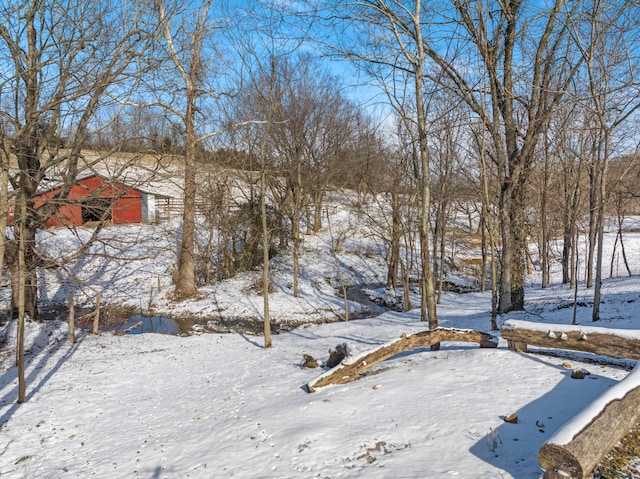 view of yard layered in snow