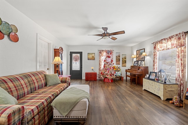 living room with ceiling fan and dark hardwood / wood-style floors