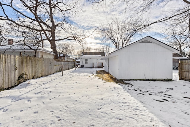 view of yard layered in snow