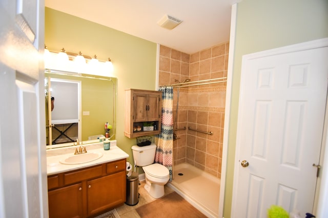 bathroom with toilet, tile patterned floors, a shower with curtain, and vanity