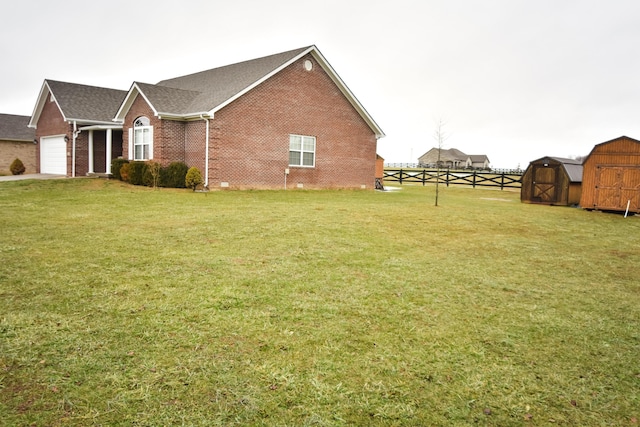 view of property exterior with a shed and a yard