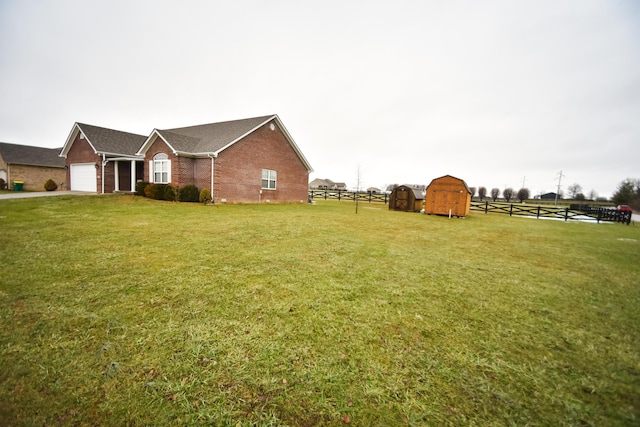 view of yard with a shed and a garage