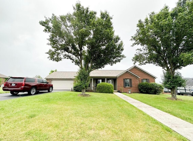 ranch-style house with a garage and a front yard