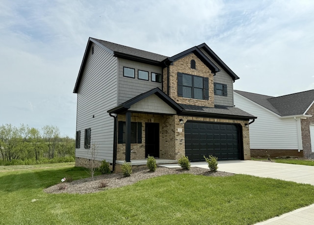 craftsman-style home with a front lawn, driveway, and a garage