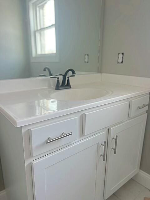 bathroom with vanity and tile patterned flooring