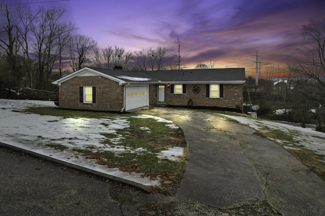 single story home featuring a garage