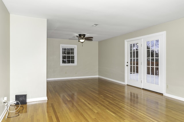 spare room featuring ceiling fan and wood-type flooring