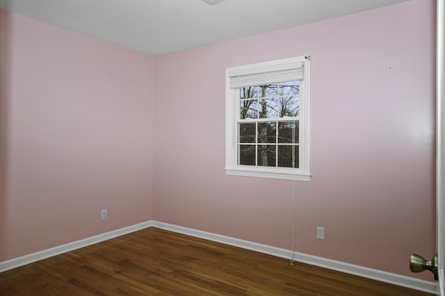 empty room with dark hardwood / wood-style floors