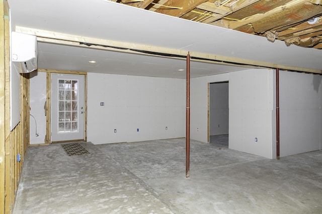 basement featuring a wall unit AC