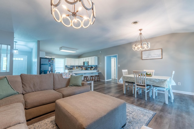 1216 Maple Hill Dr, Somerset, KY 42503 - living room featuring a chandelier, vaulted ceiling, dark wood-style floors, and baseboards