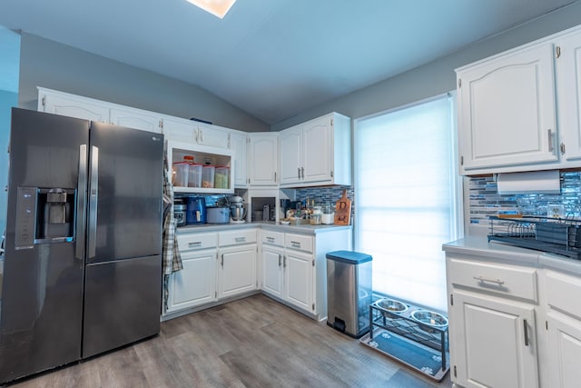 1216 Maple Hill Dr, Somerset, KY 42503 - kitchen with refrigerator with ice dispenser, backsplash, light wood-type flooring, vaulted ceiling, and white cabinetry