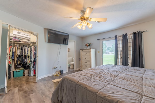 1216 Maple Hill Dr, Somerset, KY 42503 - bedroom with a spacious closet, wood finished floors, a closet, access to outside, and baseboards