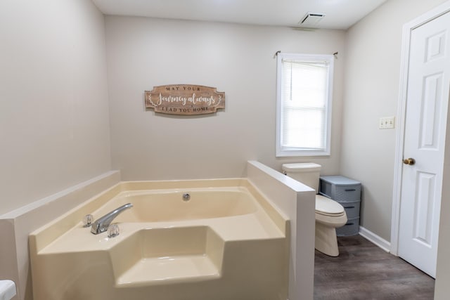 1216 Maple Hill Dr, Somerset, KY 42503 - bathroom with toilet, a bath, and wood finished floors