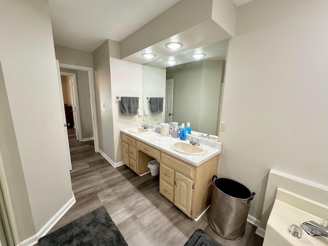 bathroom with vanity and hardwood / wood-style floors