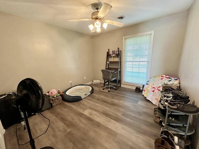 miscellaneous room featuring ceiling fan and hardwood / wood-style floors