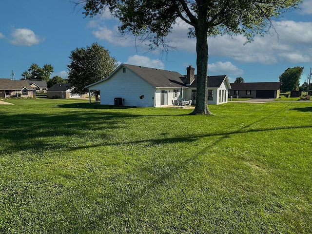 view of yard with central air condition unit