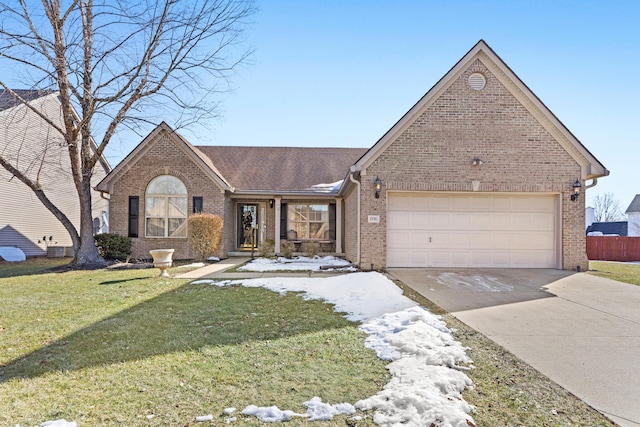 view of front of home with a garage and a front lawn