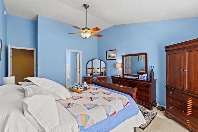 carpeted bedroom featuring lofted ceiling, a textured ceiling, and ceiling fan