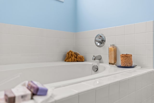 bathroom with tiled bath