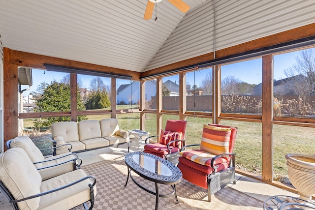 sunroom / solarium featuring lofted ceiling, a mountain view, and ceiling fan