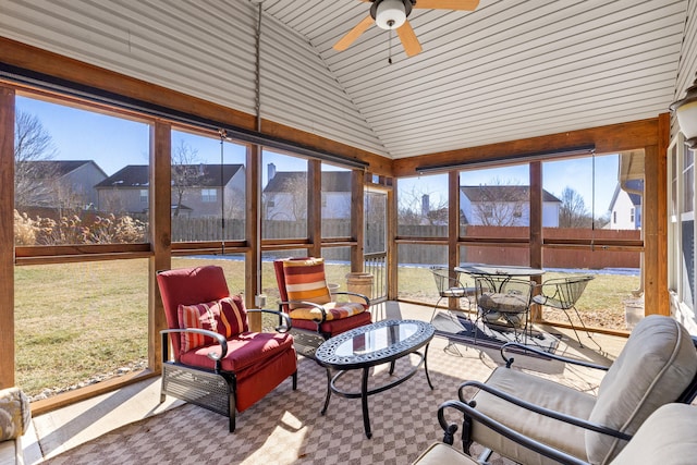 sunroom with lofted ceiling and ceiling fan