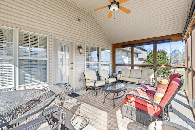 sunroom with vaulted ceiling and ceiling fan