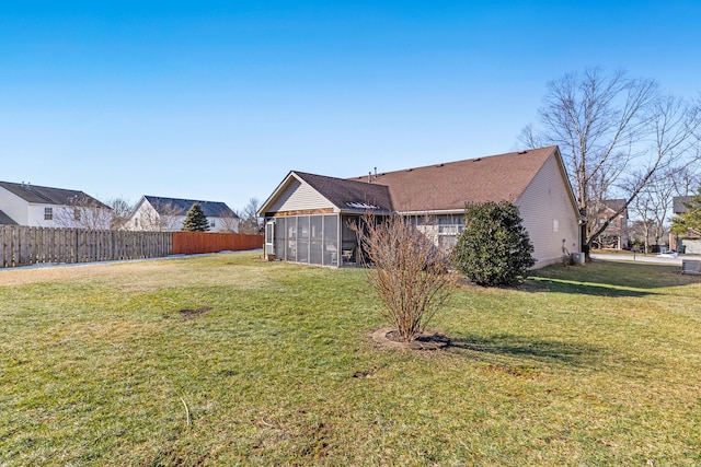 view of yard featuring a sunroom