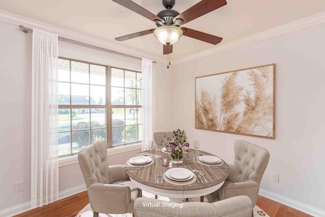 dining room featuring ceiling fan, crown molding, and hardwood / wood-style flooring