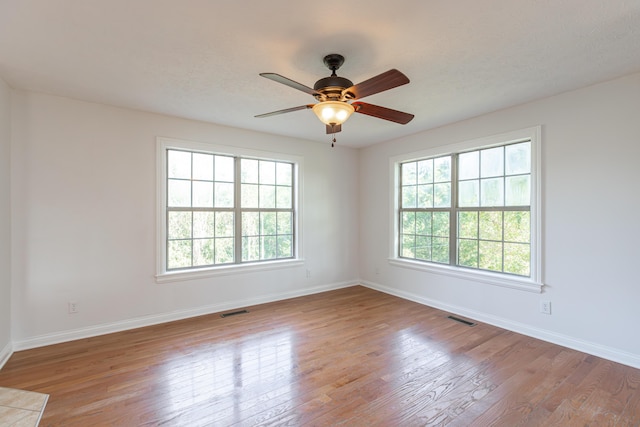 unfurnished room with light hardwood / wood-style floors and ceiling fan