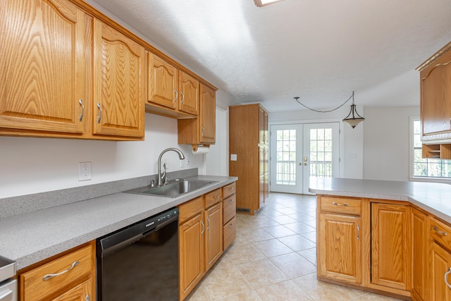 kitchen with dishwasher, sink, hanging light fixtures, light tile patterned floors, and french doors